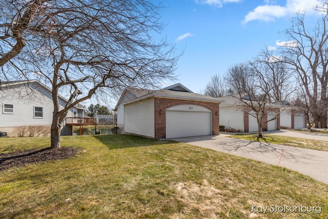 view of property exterior featuring brick siding, a garage, a yard, an outbuilding, and driveway