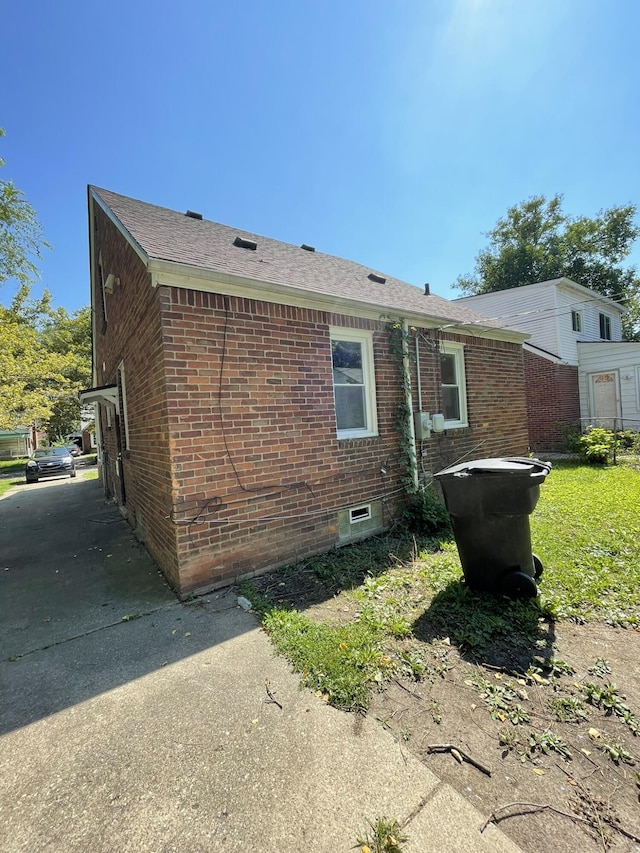 exterior space featuring brick siding