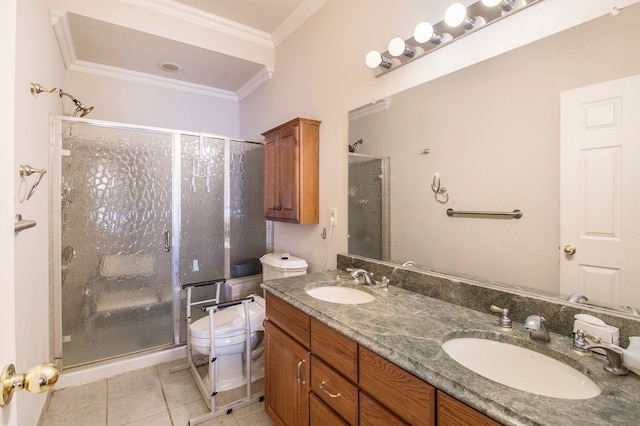 bathroom featuring tile patterned flooring, ornamental molding, a stall shower, and a sink