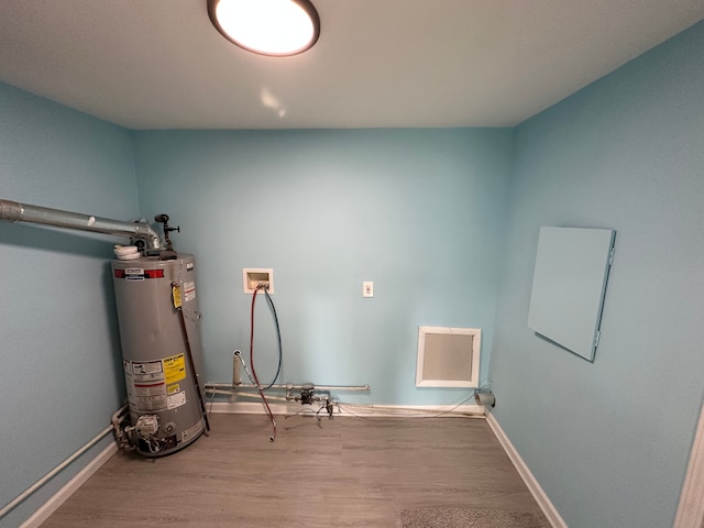 utility room with gas water heater