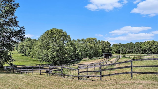 view of yard featuring an outbuilding and a rural view