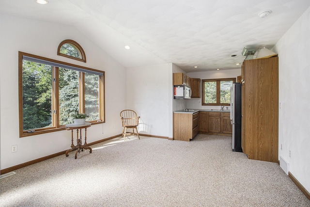 unfurnished room with visible vents, light carpet, recessed lighting, baseboards, and vaulted ceiling