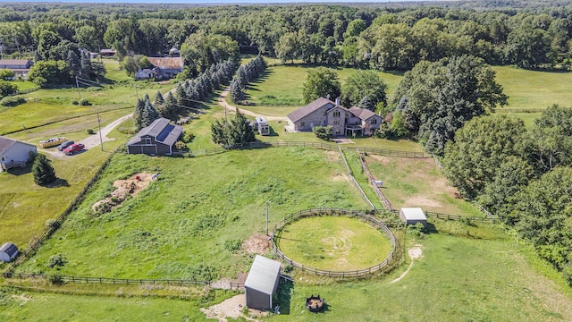 aerial view featuring a rural view and a view of trees