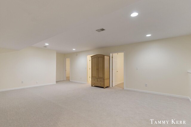 unfurnished room with recessed lighting and baseboards