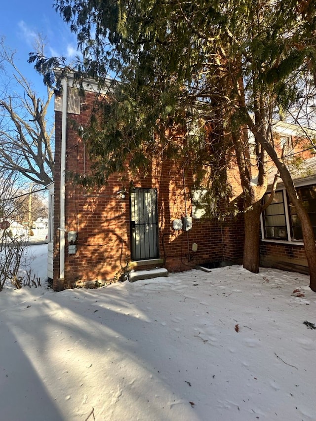 exterior space featuring brick siding