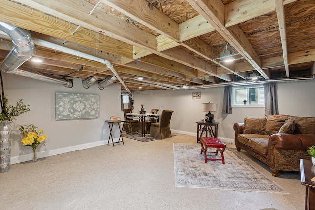 living area featuring baseboards