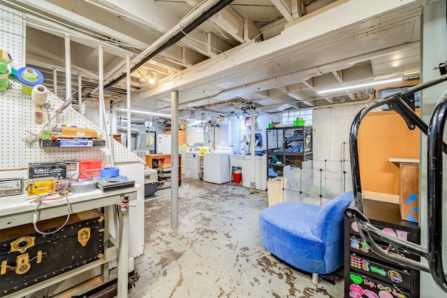 unfinished basement with washing machine and dryer