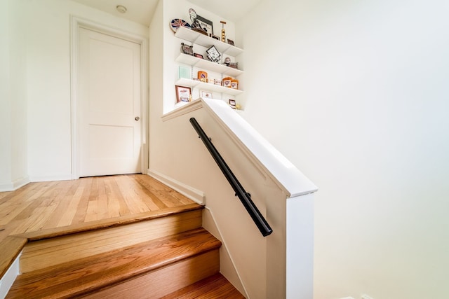 stairs with wood finished floors