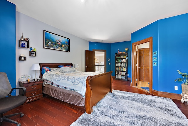 bedroom featuring dark wood finished floors