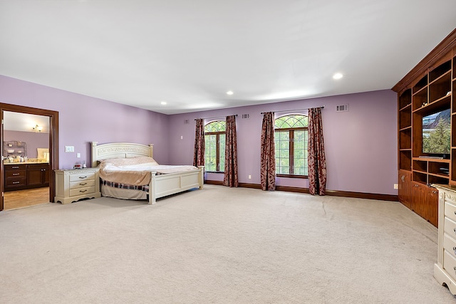 bedroom with recessed lighting, visible vents, light carpet, and baseboards