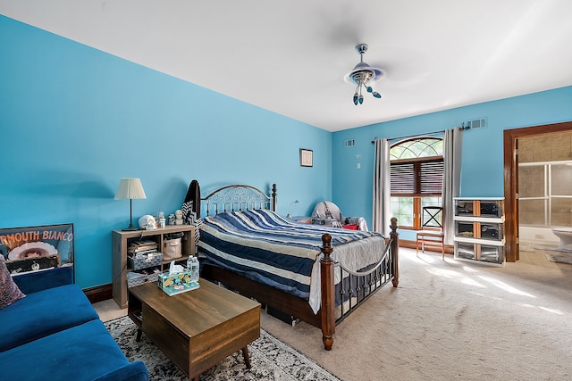 bedroom with visible vents and carpet flooring