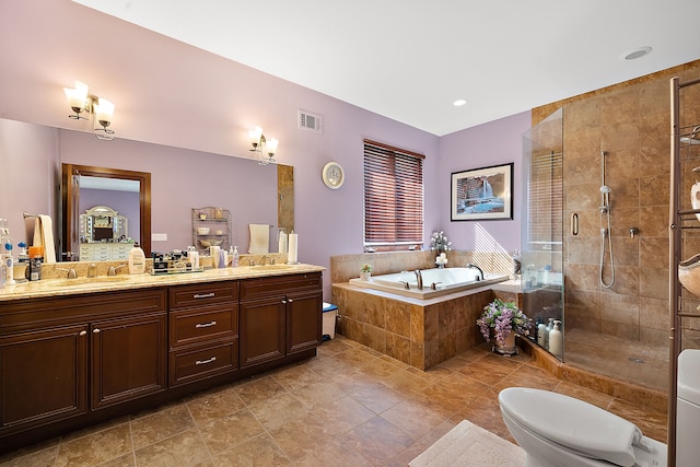 bathroom featuring visible vents, double vanity, a stall shower, a sink, and a bath