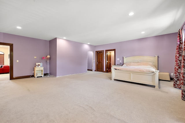 unfurnished bedroom featuring recessed lighting and carpet