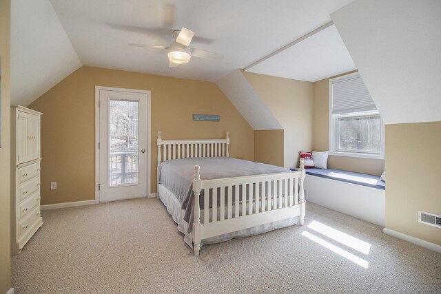 bedroom featuring visible vents, light carpet, a ceiling fan, access to outside, and vaulted ceiling