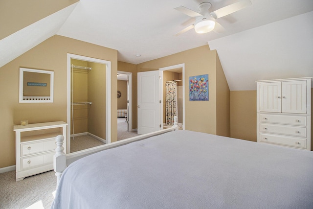 carpeted bedroom featuring baseboards, ceiling fan, and vaulted ceiling