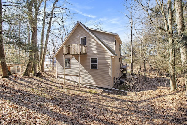 back of property featuring a balcony