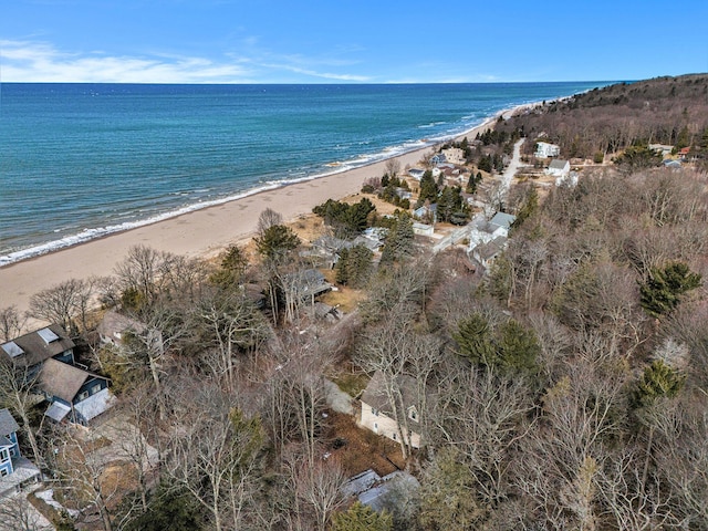 drone / aerial view featuring a water view and a view of the beach