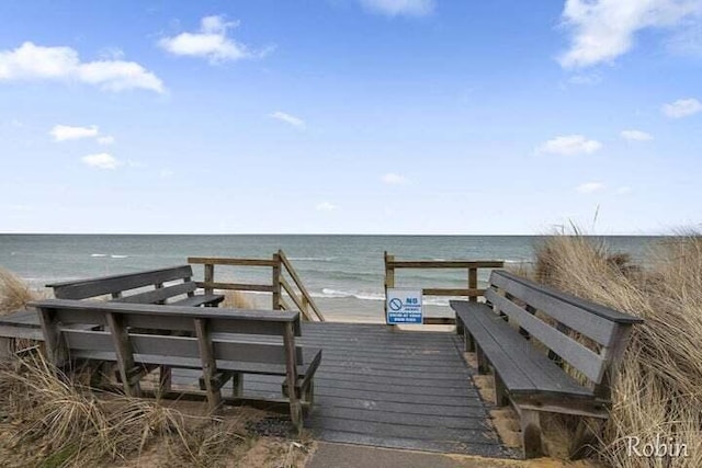 view of property's community with a view of the beach and a water view