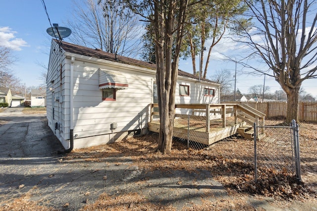 exterior space featuring a deck and fence