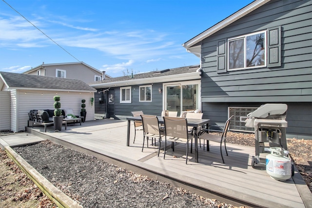 deck with area for grilling and outdoor dining space