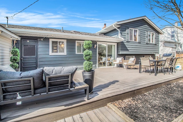 wooden terrace featuring an outdoor hangout area and outdoor dining area