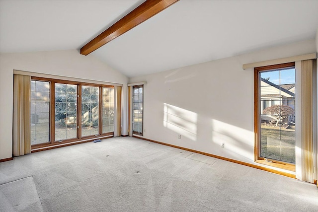 spare room featuring visible vents, vaulted ceiling with beams, carpet, and baseboards