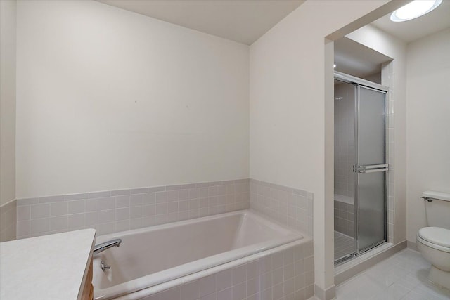 full bath featuring a bath, tile patterned flooring, a stall shower, and toilet