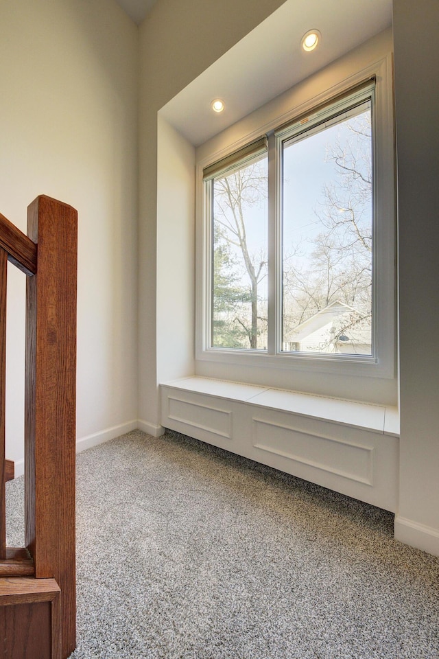 spare room featuring recessed lighting, baseboards, and carpet floors