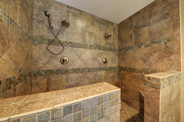 bathroom with a tile shower