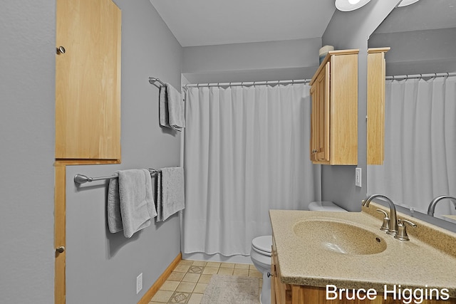 bathroom with tile patterned floors, toilet, a shower with shower curtain, and vanity