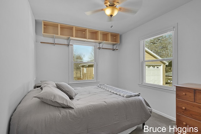 bedroom with baseboards, carpet, and a ceiling fan