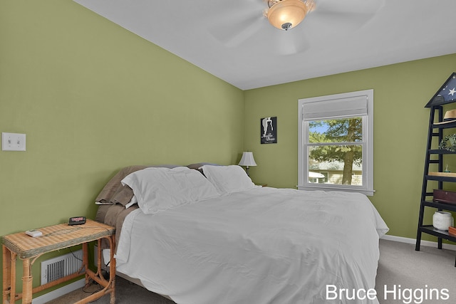 carpeted bedroom featuring baseboards and a ceiling fan