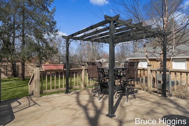 view of patio / terrace featuring outdoor dining area, fence, a pergola, and a wooden deck