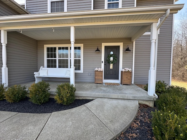 property entrance featuring a porch