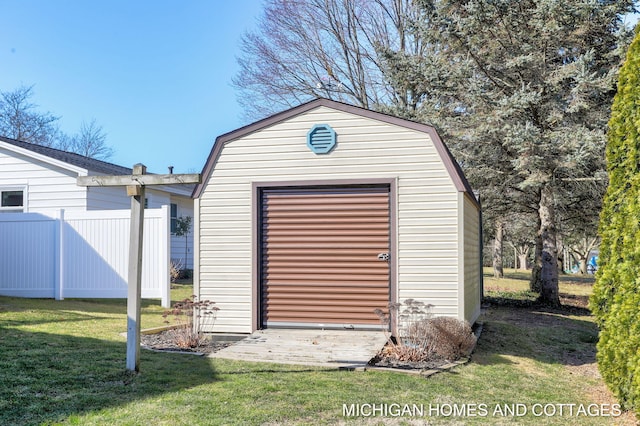 view of shed with fence