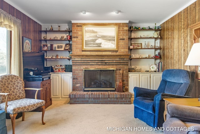 living room with light colored carpet, wood walls, a fireplace, and ornamental molding