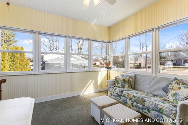 sunroom / solarium with ceiling fan