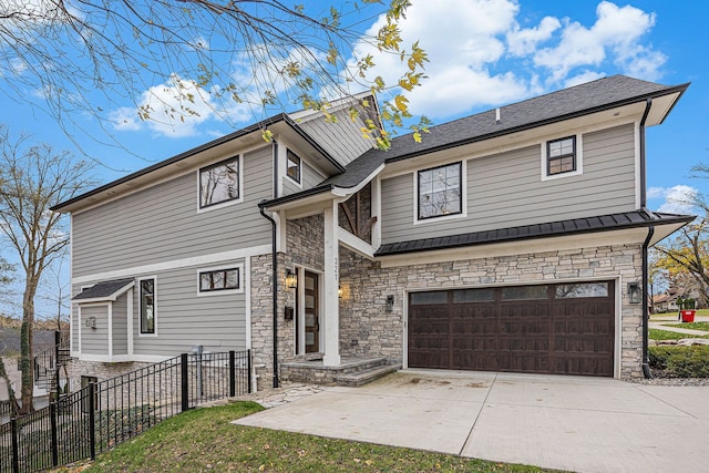 view of front of property featuring concrete driveway, fence, a garage, and stone siding