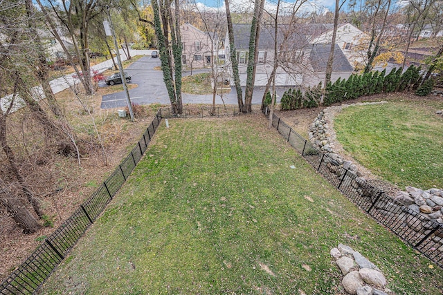 view of yard with fence and a residential view