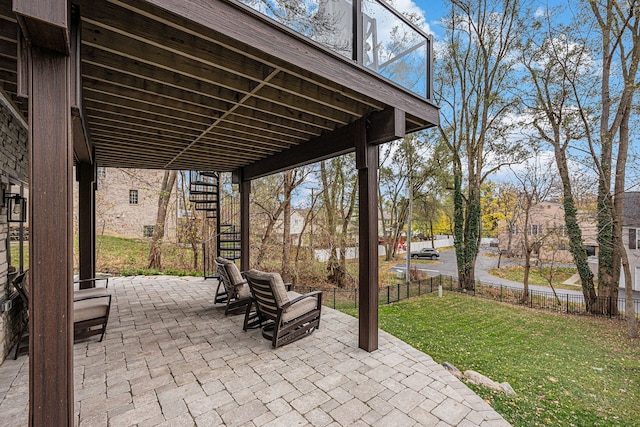 view of patio / terrace with stairway and fence