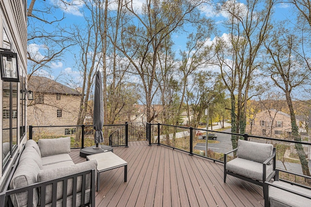 wooden deck featuring an outdoor living space