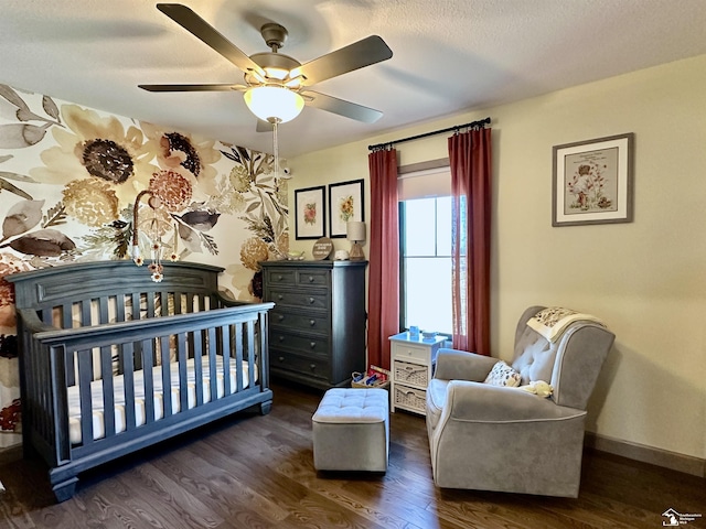 bedroom featuring dark wood finished floors, ceiling fan, and baseboards