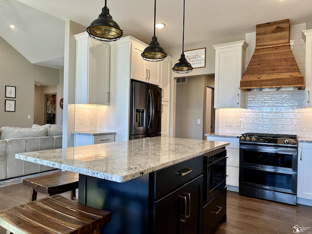 kitchen with custom range hood, dark wood finished floors, white cabinets, range with two ovens, and black refrigerator with ice dispenser