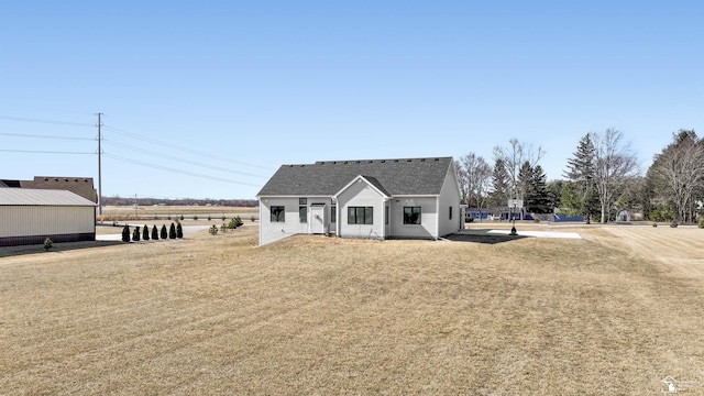 modern inspired farmhouse with a shingled roof