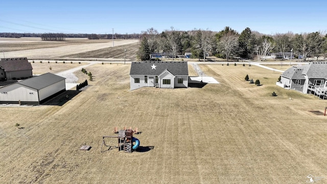 birds eye view of property featuring a rural view