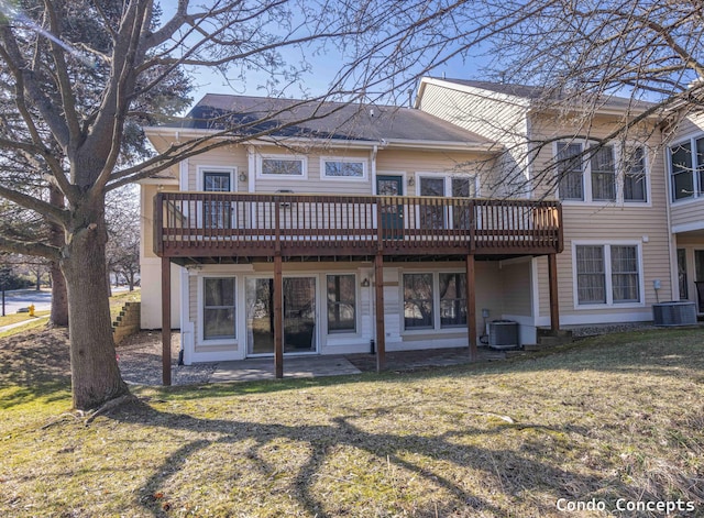 back of property featuring cooling unit, a lawn, and a wooden deck