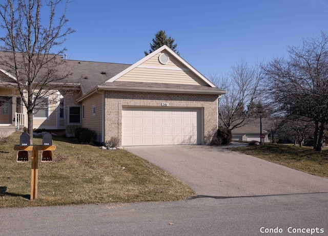 view of front of property featuring brick siding, concrete driveway, a garage, and a front yard