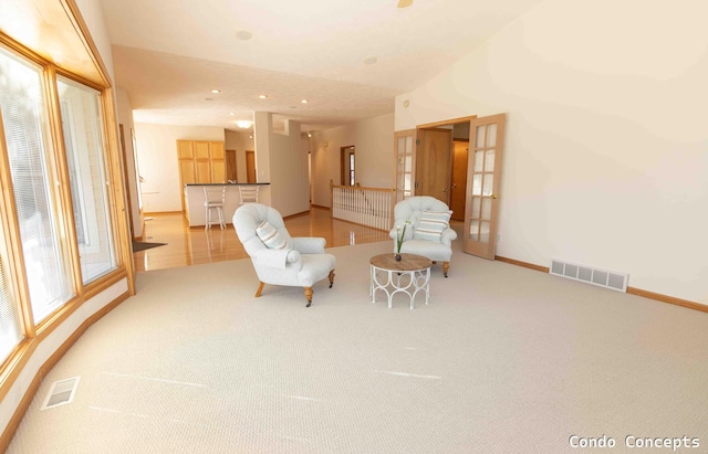 sitting room with visible vents, recessed lighting, carpet, and baseboards