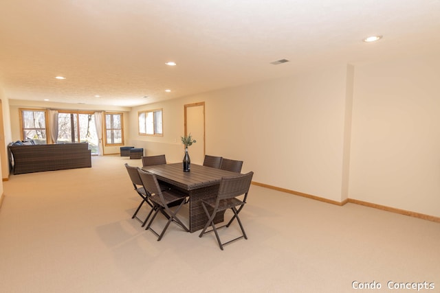 dining space with light carpet, visible vents, recessed lighting, and baseboards