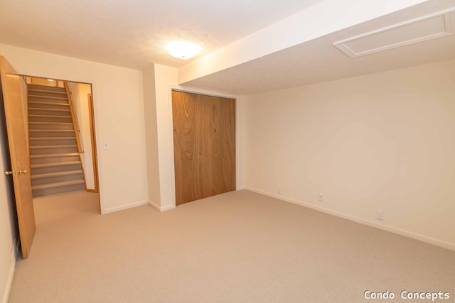 unfurnished bedroom featuring a closet, baseboards, carpet floors, and a textured ceiling